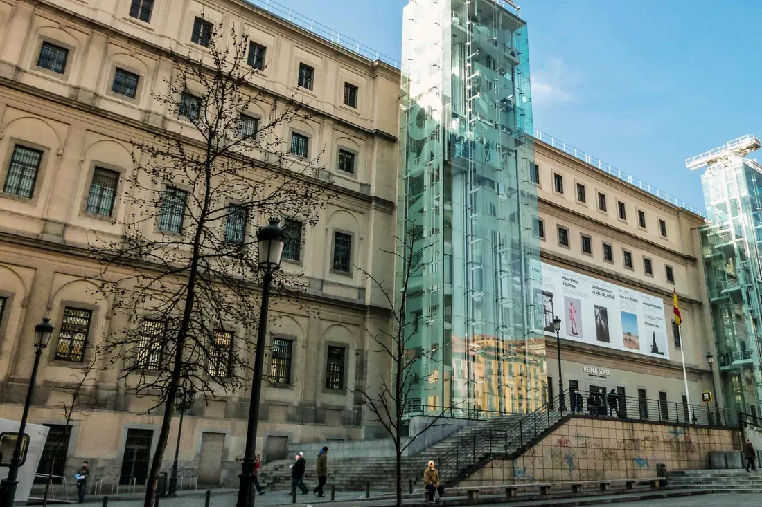 The glass lifts on the facade of the Reina Sofía, the leading modern art museum in Madrid, Spain