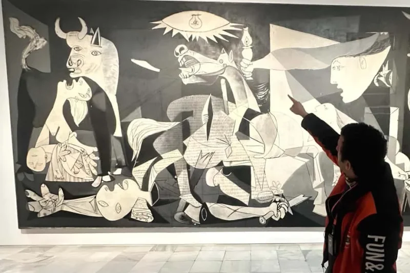 Picasso's Guernica on display at the Reina Sofia, a leading modern art museum in Madrid, Spain