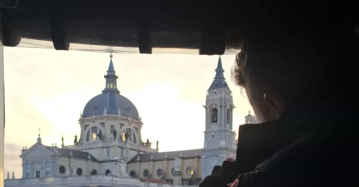 A tuk-tuk passing landmarks in the historic centre of Madrid, Spain